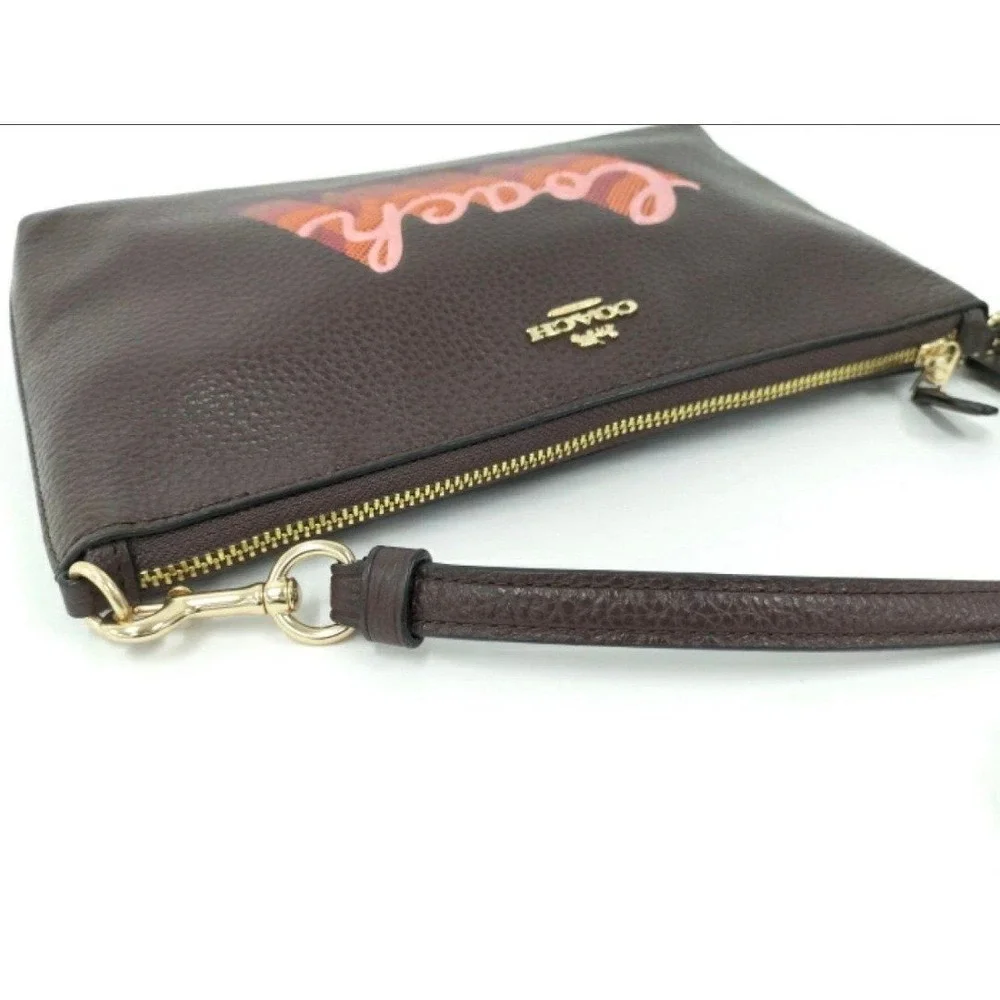 LARGE WRISTLET 25 WITH NEON COACH SCRIPT COACH NWT